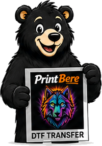 Benny the PrintBere bear holding a DTF transfer
